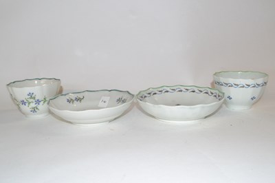 Lot 411 - Two Lowestoft porcelain tea bowls and saucers,...