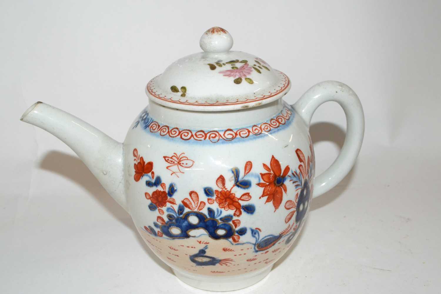 Lot 414 - A Lowestoft porcelain teapot decorated in...
