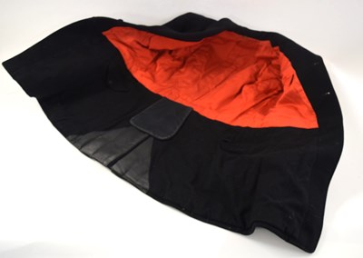 Lot 41 - Is a black hunt coat with red lining and black...