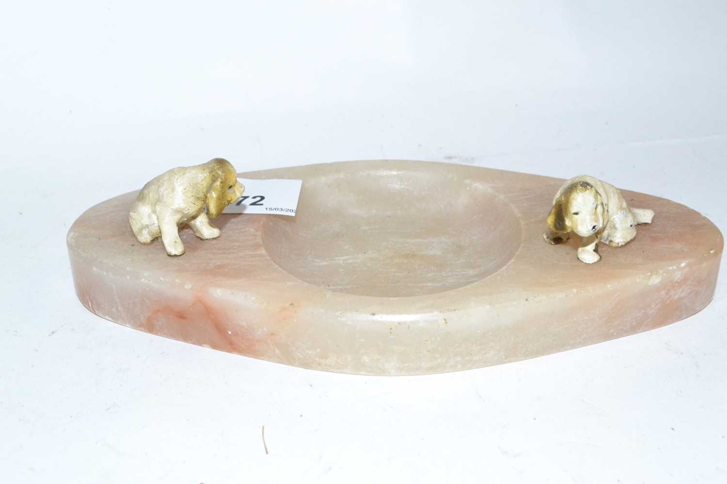 Lot 472 - An onyx ashtray mounted with two painted dogs