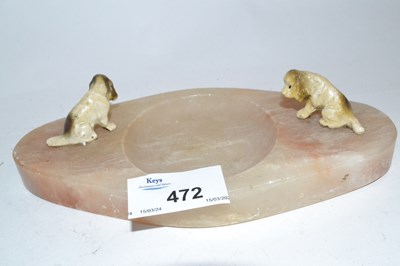 Lot 472 - An onyx ashtray mounted with two painted dogs