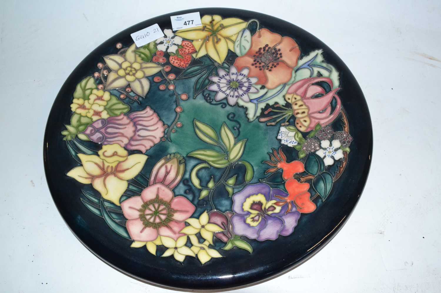 Lot 477 - A modern Moorcroft charger with tubelined...