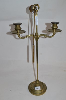 Lot 514 - Brass candelabra with snuffer, 54cm high