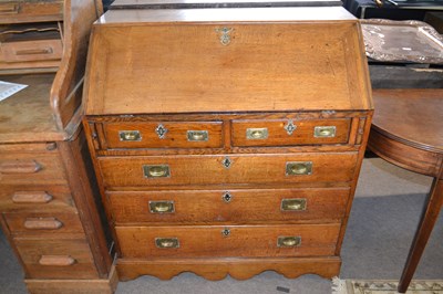 Lot 536 - George III oak bureau of typical form with...