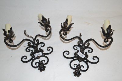 Lot 559 - A pair of iron wall sconce light fittings,...