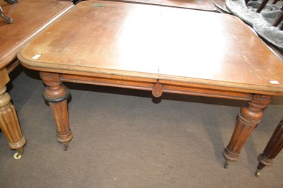 Lot 584 - A Victorian faded oak extending dining table...