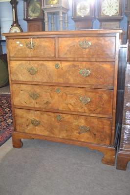 Lot 604 - A Georgian walnut chest of two short over...