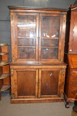 Lot 647 - Victorian walnut veneered bookcase cabinet...