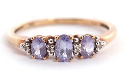 Lot 5 - A 9ct tanzanite and white stone ring, the...