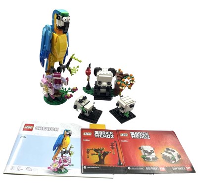 Lot 156 - A pair of modern Lego sets and manuals, to...