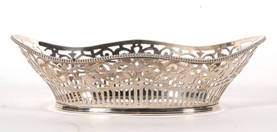 Lot 1 - A silver basket of navett form pierced...
