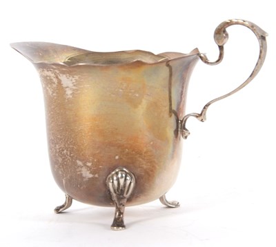 Lot 2 - A George VI silver cream jug hallmarked for...