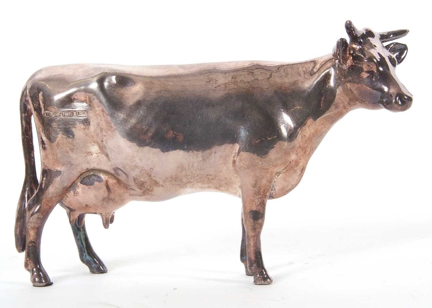 Lot 12 - An Elizabeth II silver Guernsey cow model,...