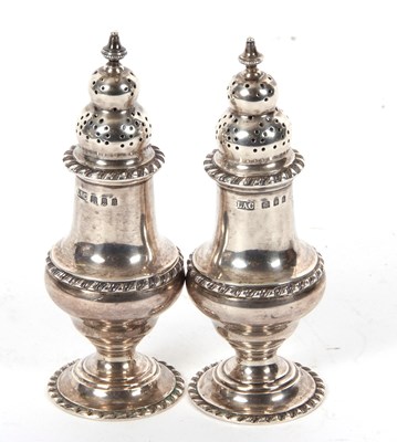 Lot 16 - Pair of George V silver pepper casters of...