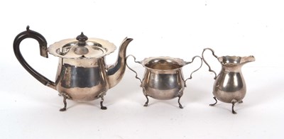 Lot 36 - Three pieces of hallmarked silver tea ware to...