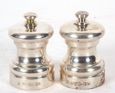 Lot 89 - A pair of Elizabeth II silver salt and pepper...