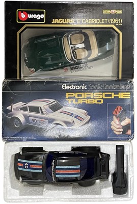 Lot 79 - A pair of boxed car models, to include: - An...