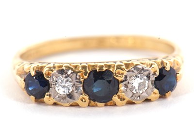Lot 22 - An 18ct sapphire and diamond ring, the three...