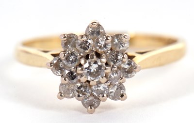 Lot 3 - An 18ct diamond cluster ring, the central...