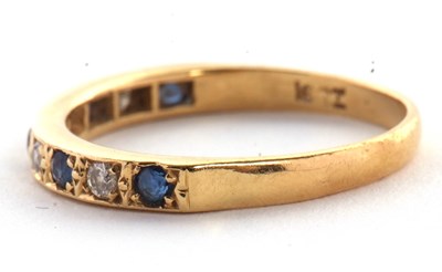 Lot 56 - An 18ct sapphire and diamond ring, the half...
