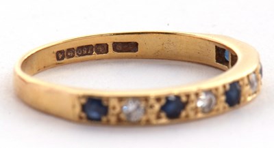 Lot 56 - An 18ct sapphire and diamond ring, the half...
