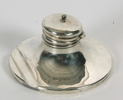 Lot 3 - An Edwardian silver capstan ink well with...