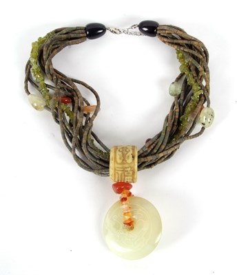 Lot 237 - A mixed hardstone necklace, with round jade...