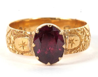 Lot 39 - A garnet ring, the oval collet and claw...