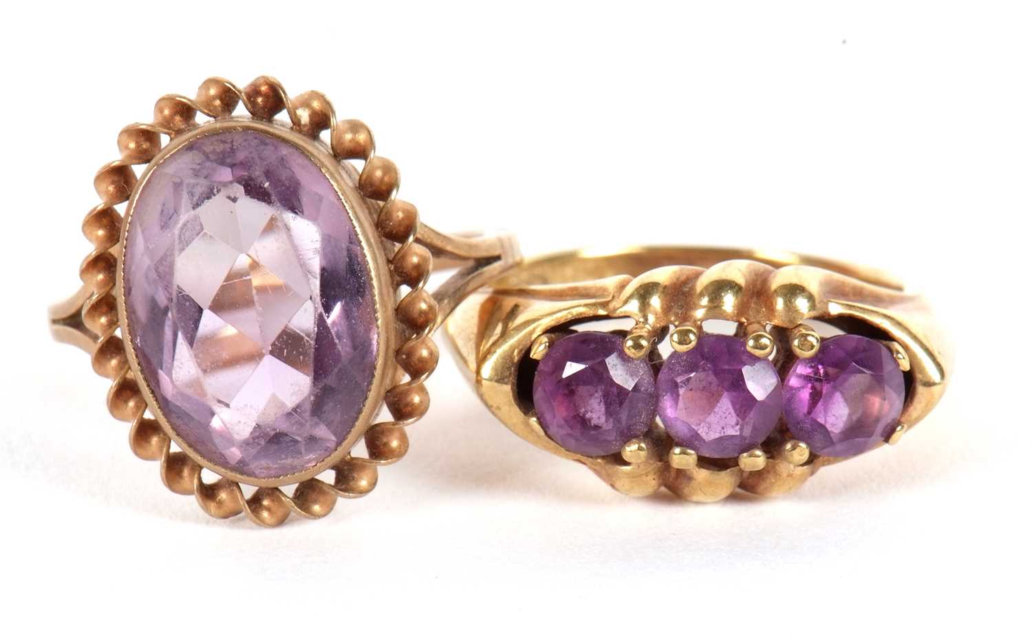 Lot 72 - Two amethyst rings, the first an oval collet...