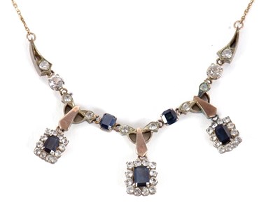 Lot 98 - A sapphire and white stone necklace, the three...