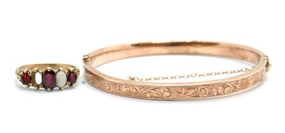 Lot 191 - A 9ct bangle and a 9ct ring, the rose gold...