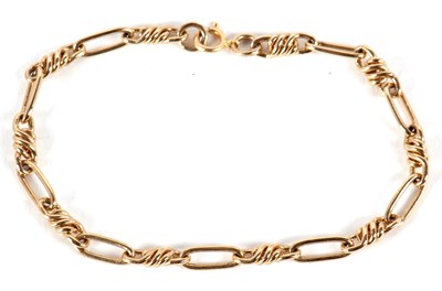 Lot 195 - A fancy link bracelet, with clasp stamped 14k,...