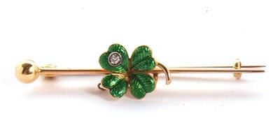 Lot 111 - An enamelled four leaf clover bar brooch, the...