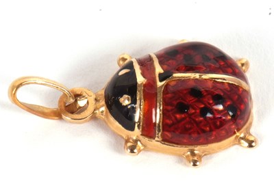 Lot 127 - A ladybird pendant, the domed red and black...