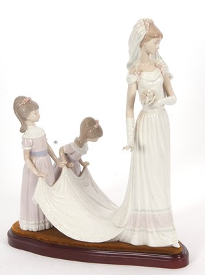 Lot 23 - A Lladro group of a bride with bridesmaids on...