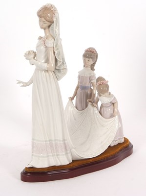 Lot 23 - A Lladro group of a bride with bridesmaids on...