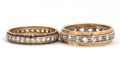 Lot 67 - Two eternity rings, one with a central channel...