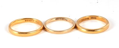 Lot 209 - Three gold rings: one 22ct ring hallmarked...