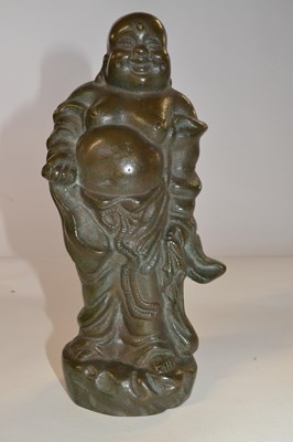Lot 330 - A Chinese bronze figure of an immortal, 24cm high