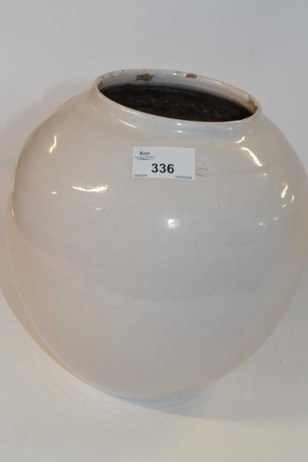 Lot 336 - A large ovoid pottery bowl with grey glaze,...