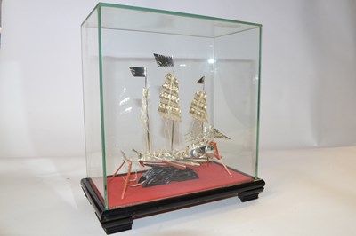 Lot 282 - A white metal model of a Chinese junk, in...
