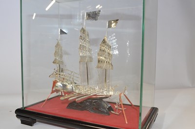 Lot 282 - A white metal model of a Chinese junk, in...