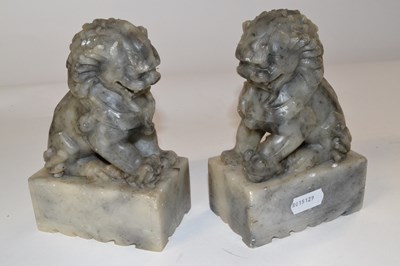 Lot 342 - A pair of Oriental soapstone lions on...