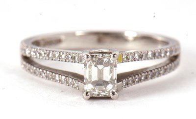 Lot 82 - A certified platinum diamond ring, the central...