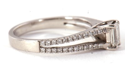 Lot 48 - A certified platinum diamond ring, the central...