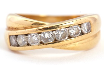 Lot 64 - An 18ct diamond crossover ring, with a two...