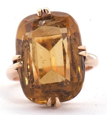 Lot 27 - A 9ct citrine ring, the oval mixed cut citrine,...