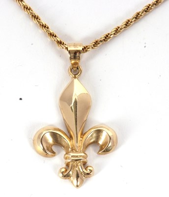 Lot 123 - A fleur de lys gold necklace, the fleur de lys...