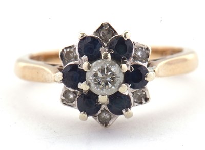Lot 10 - A 9ct sapphire and diamond cluster ring, the...
