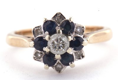 Lot 10 - A 9ct sapphire and diamond cluster ring, the...
